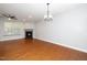 Living room with hardwood floors, a ceiling fan, and a fireplace at 520 Camden Yards Way, Cary, NC 27519