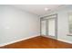 Room with hardwood floors and french doors leading to outside at 520 Camden Yards Way, Cary, NC 27519