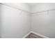Walk-in closet providing ample storage space with wire shelving and carpeting at 520 Camden Yards Way, Cary, NC 27519