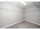 Spacious walk-in closet providing ample storage space with wire shelving and carpeting at 520 Camden Yards Way, Cary, NC 27519