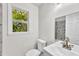 Bright bathroom with modern fixtures, marble shower, and a well-lit vanity at 5236 Turf Grass Ct, Raleigh, NC 27610