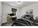 Staged bedroom with stylish desk, decor, and bed, creating a comfortable workspace at 5236 Turf Grass Ct, Raleigh, NC 27610