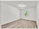 Spacious bedroom featuring hardwood floors, natural light, and ample space at 5236 Turf Grass Ct, Raleigh, NC 27610