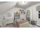Staged bedroom with cute decorations, bed and playful furniture at 5236 Turf Grass Ct, Raleigh, NC 27610