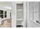 Bright closet with shelving, accessible from entry, and hardwood floors throughout home at 5236 Turf Grass Ct, Raleigh, NC 27610