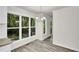 A bright dining area boasts a modern chandelier and lots of natural light at 5236 Turf Grass Ct, Raleigh, NC 27610