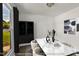 This staged dining room features modern furnishings and decor at 5236 Turf Grass Ct, Raleigh, NC 27610