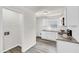 This updated kitchen features white cabinets and granite countertops at 5236 Turf Grass Ct, Raleigh, NC 27610