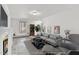 Bright living room featuring wood-look floors, fireplace, and stylish furniture at 5236 Turf Grass Ct, Raleigh, NC 27610