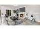 Bright living room featuring wood-look floors, fireplace, and sliding glass doors to the backyard at 5236 Turf Grass Ct, Raleigh, NC 27610