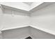 An open walk-in closet providing storage space for a modern home at 5236 Turf Grass Ct, Raleigh, NC 27610
