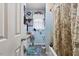 Full bathroom featuring a shower-tub combination and blue tile at 586 New Hope Church Rd, Apex, NC 27523