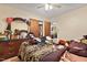 Bedroom featuring a wooden dresser and large bed at 586 New Hope Church Rd, Apex, NC 27523