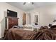 Comfortable bedroom featuring a large bed, dresser, and television at 586 New Hope Church Rd, Apex, NC 27523