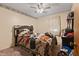 Bedroom with a ceiling fan, a headboard, and natural light coming from window at 586 New Hope Church Rd, Apex, NC 27523