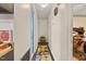 Hallway with yellow and gray runner carpet and white walls at 586 New Hope Church Rd, Apex, NC 27523