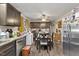 Features updated cabinets, stainless steel appliances, and a dining area at 586 New Hope Church Rd, Apex, NC 27523