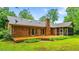 Exterior showcasing a spacious wooden deck perfect for outdoor entertaining and relaxation at 5939 Florasaline Dr, Mebane, NC 27302