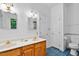 Bathroom featuring a double vanity, bright lighting, and neutral finishes at 5939 Florasaline Dr, Mebane, NC 27302