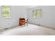 Bedroom featuring neutral carpet, white walls, and natural light from dual windows at 5939 Florasaline Dr, Mebane, NC 27302