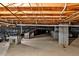 Crawlspace with a vapor barrier, sturdy brick supports, and visible utilities at 5939 Florasaline Dr, Mebane, NC 27302