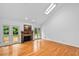 Bright living room features hardwood floors, fireplace and access to screened porch at 5939 Florasaline Dr, Mebane, NC 27302