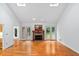 Bright living room features hardwood floors, fireplace and access to screened porch at 5939 Florasaline Dr, Mebane, NC 27302