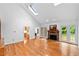 Bright living room features hardwood floors, fireplace and access to screened porch at 5939 Florasaline Dr, Mebane, NC 27302