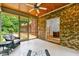 Inviting screened porch offers views of the brick home and green surroundings at 5939 Florasaline Dr, Mebane, NC 27302