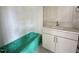 Bathroom showcasing a green bathtub, white subway tile, and a stylish vanity at 6501 Burnette Flower Way, Raleigh, NC 27612