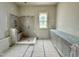 New bathroom features a shower and vanity with natural light from a window at 6501 Burnette Flower Way, Raleigh, NC 27612