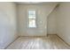Light and airy room with window and hardwood flooring, perfect for customization at 6501 Burnette Flower Way, Raleigh, NC 27612