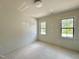 Bright bedroom featuring natural light through large windows at 6501 Burnette Flower Way, Raleigh, NC 27612