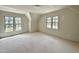 Bright bedroom with two windows and neutral walls at 6501 Burnette Flower Way, Raleigh, NC 27612