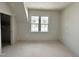 A well-lit room with a window, showing the blank canvas of possibility at 6501 Burnette Flower Way, Raleigh, NC 27612