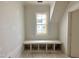 Bright room with built-in bench under the window featuring storage cubbies and a neutral color palette at 6501 Burnette Flower Way, Raleigh, NC 27612