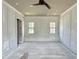 Bedroom with crown moulding, two windows, a ceiling fan, and an adjacent closet at 6501 Burnette Flower Way, Raleigh, NC 27612