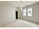Room with natural light from two windows and an ensuite bathroom at 6501 Burnette Flower Way, Raleigh, NC 27612