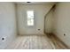 Room with wood floors and natural light from one window at 6501 Burnette Flower Way, Raleigh, NC 27612