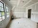 Room with natural light from three windows and an ensuite bathroom at 6501 Burnette Flower Way, Raleigh, NC 27612