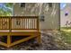 Close up on a wooden deck and the back of the home's beige siding at 6604 Frogstool Ln, Raleigh, NC 27610