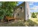 Two-story home featuring a wooden deck and lawn surrounded by trees at 6604 Frogstool Ln, Raleigh, NC 27610