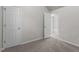 Bedroom featuring carpeted floors, neutral walls, and white trim at 6604 Frogstool Ln, Raleigh, NC 27610
