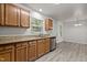 Bright kitchen featuring stainless steel appliances and granite countertops at 6604 Frogstool Ln, Raleigh, NC 27610