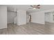 Spacious living room with wood look floors, ceiling fan, and open floor plan at 6604 Frogstool Ln, Raleigh, NC 27610