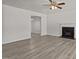 Bright and airy living room featuring a fireplace and wood look floors at 6604 Frogstool Ln, Raleigh, NC 27610