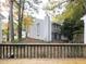View of the backyard from the deck with fall foliage at 7353 Sandy Creek Dr, Raleigh, NC 27614