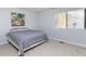 Comfortable bedroom with a large window and neutral-colored carpet at 7353 Sandy Creek Dr, Raleigh, NC 27614