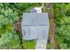 Aerial view of a well-maintained home with a new roof, back deck, and wooded surroundings at 776 Legend Oaks Dr, Chapel Hill, NC 27517