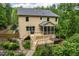 Expansive backyard with a large deck, screened porch, and hot tub perfect for outdoor relaxation at 776 Legend Oaks Dr, Chapel Hill, NC 27517